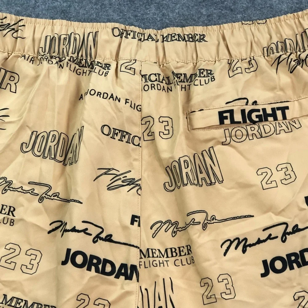 Jordan Mens Flight Club Shorts Medium Tan All-Over Print Graphic Drawstring